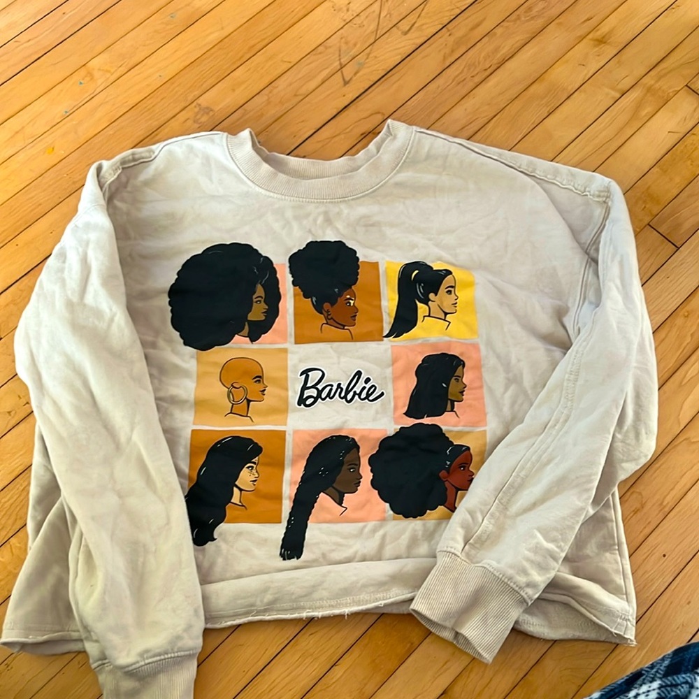 A melanin barbie sweater.